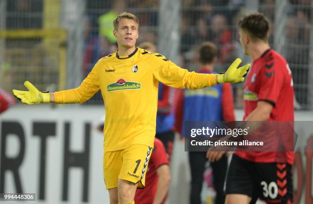 Freiburg's keeper Alexander Schwolow complains after conceding a goal during the German Bundesliga soccer match between SC Freiburg and Hannover 96...