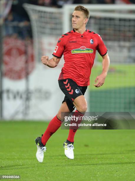 Freiburg's Nils Petersen celebrates after levelling the score at 1:1 during the German Bundesliga soccer match between SC Freiburg and Hannover 96 in...