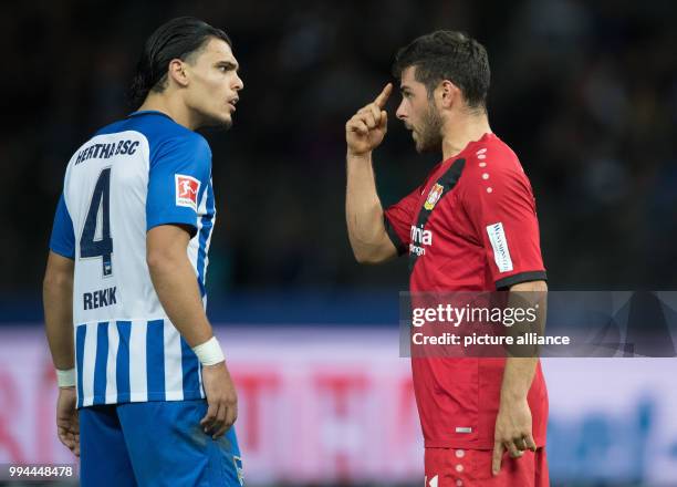 Hertha's Karim Rekik and Leverkusen's Kevin Volland exchange words during the German Bundesliga soccer match between Hertha BSC and Bayer Leverkusen...