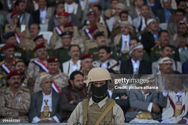 Houthi militiaman keeps watch during a rally commemorating the third anniversary of the Houthis' capture of the Yemeni capital, in Sanaa, Yemen, 21...