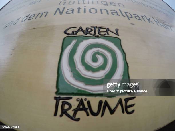 June 2018, Germany, Brocken: The logo 'Gartentraeume' on a sign on the Brocken. With the Brocken Garden the popular tourism network 'Gartentraeume',...