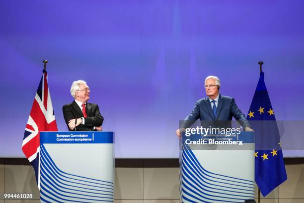 David Davis, U.K. Exiting the European Union secretary, left, reacts as Michel Barnier, chief negotiator for the European Union , looks on during a...