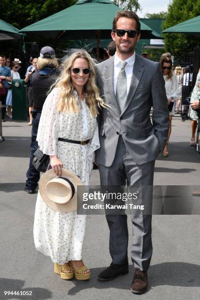 Sir Ben Ainslie and his wife Georgie Thompson attend day seven of the Wimbledon Tennis Championships at the All England Lawn Tennis and Croquet Club...
