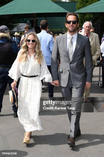 Sir Ben Ainslie and his wife Georgie Thompson attend day seven of the Wimbledon Tennis Championships at the All England Lawn Tennis and Croquet Club...