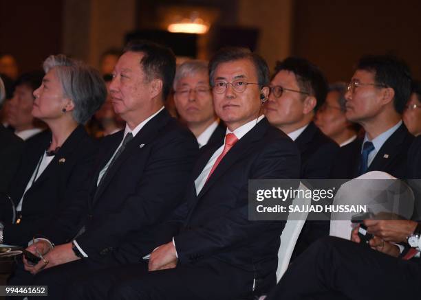 South Korea's President Moon Jae-in looks on before his speech at the 'India-Korea Business Forum' in New Delhi on July 9, 2018. - The event was...