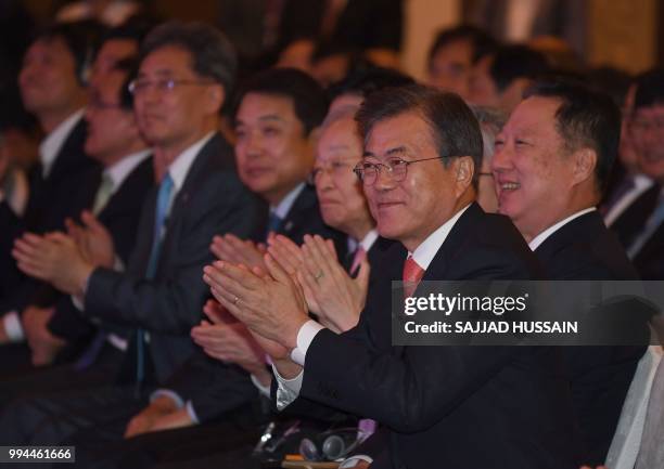 South Korea's President Moon Jae-in gestures before his speech at the 'India-Korea Business Forum' in New Delhi on July 9, 2018. - The event was...