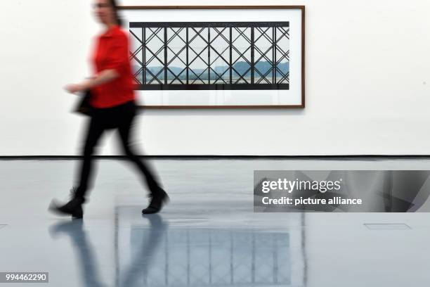 Woman walks past a work by German photographer Axel Hütte in the Art Palace Museum in Düsseldorf, Germany, 21 September 2017. The museum is hosting a...