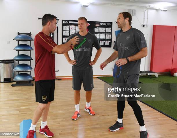 Arsenal goalkeepers Petr Cech and Bernd Leno with fitness coach Shad Forsythe during a training session at Colney on July 9, 2018 in St Albans,...