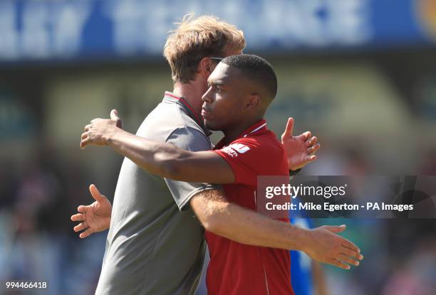 Liverpool Manager Jurgen Klopp embraces Liverpool's Daniel Sturridge after the final whistle