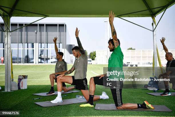 Federico Bernardeschi and Mattia Perin during a Juventus training session at Juventus Training Center on July 9, 2018 in Turin, Italy.