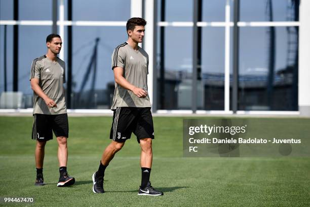 Mattia De Sciglio and Mattia Caldara during a Juventus training session at Juventus Training Center on July 9, 2018 in Turin, Italy.