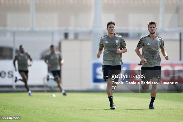 Mattia Caldara and Daniele Rugani during a Juventus training session at Juventus Training Center on July 9, 2018 in Turin, Italy.