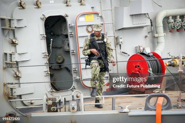 An armed serviceman stays on board of the USS Porter , an Arleigh Burke-class destroyer of the United States Navy, at the Maritime Terminal, Odesa,...