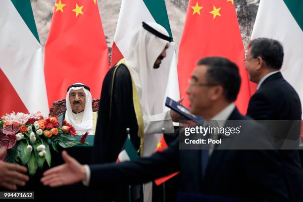 Kuwait's ruling emir, Sheikh Sabah Al Ahmad Al Sabah looks on as he and Chinese President Xi Jinping witness a signing ceremony at the Great Hall of...