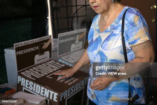 Woman votes during Mexico general elections on July 1, 2018 in Mexicali, Mexico. Andrés Manuel López Obrador, popularly known as AMLO, has won...