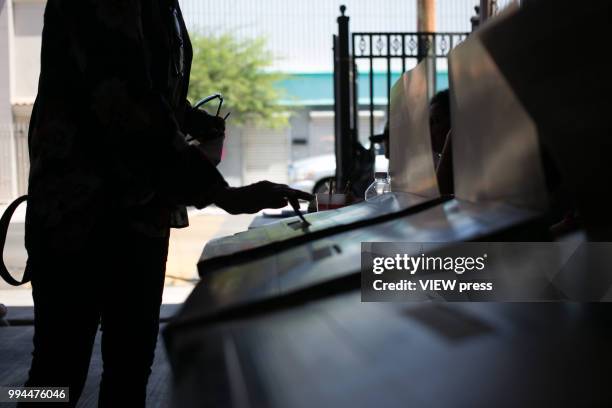 Person votes during Mexico general elections on July 1, 2018 in Mexicali, Mexico. Andrés Manuel López Obrador, popularly known as AMLO, has won...