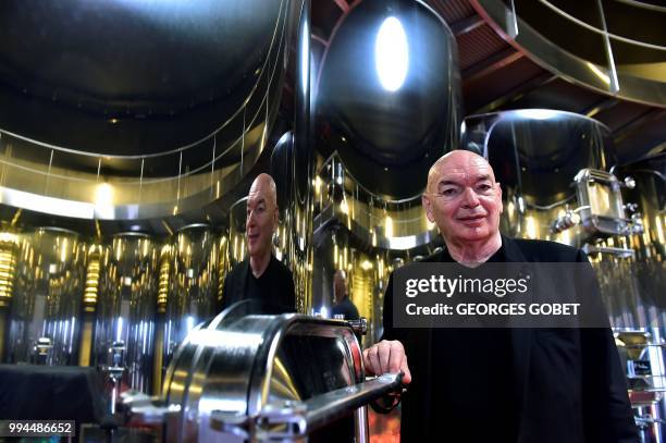 French architect Jean Nouvel poses for a photograph inside the new cuvier he designed at the Chateau La Grace Dieu des Prieurs estate, owned by...