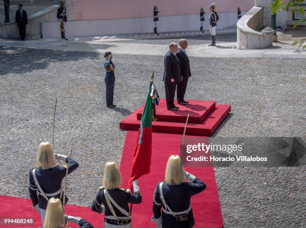 Members of the National Republican Guard stand at attention while Portuguese President Marcelo Rebelo de Sousa and Shah Karim Al-Hussaini, Prince Aga...