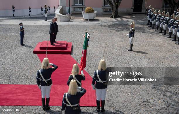 Members of the National Republican Guard stand at attention while Portuguese President Marcelo Rebelo de Sousa and Shah Karim Al-Hussaini, Prince Aga...