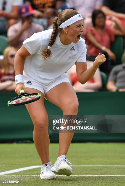 Latvia's Jelena Ostapenko celebrates a point against Belarus' Aliaksandra Sasnovich in their women's singles fourth round match on the seventh day of...