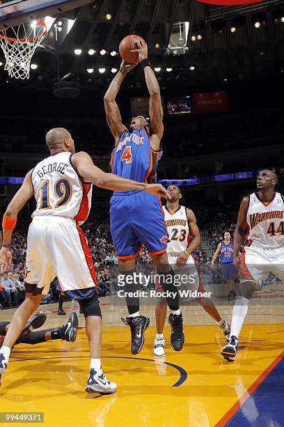 Giddens of the New York Knicks goes up for a shot against Anthony Tolliver, C.J. Watson and Devean George of the Golden State Warriors during the...