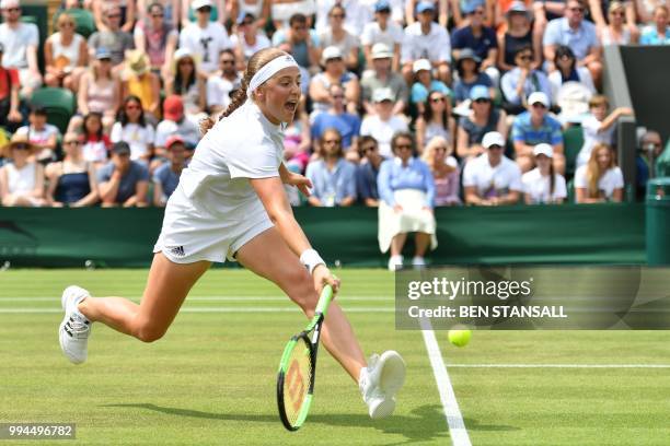 Latvia's Jelena Ostapenko returns to Belarus' Aliaksandra Sasnovich in their women's singles fourth round match on the seventh day of the 2018...