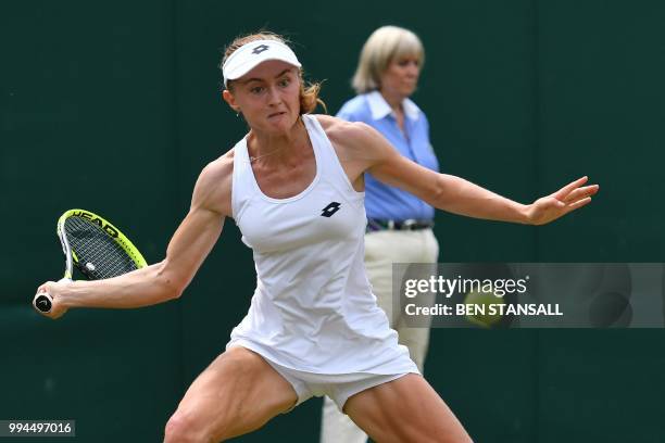 Belarus' Aliaksandra Sasnovich returns to Latvia's Jelena Ostapenko in their women's singles fourth round match on the seventh day of the 2018...