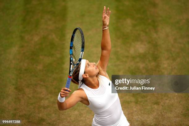 Dominika Cibulkova of Slovakia serves against Su-Wei Hsieh of Chinese Taipei during their Ladies' Singles fourth round match on day seven of the...