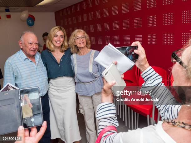 Julie Gayet poses with fans watching the World Cup Russia Quarter Final match between Uruguay and France at the Socialist Party headquarters on July...