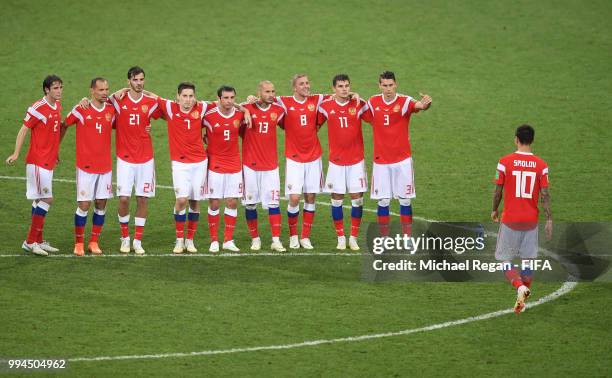 Russia players encourage Fedor Smolov after the missed penalty part of the penalty shoot out during the 2018 FIFA World Cup Russia Quarter Final...