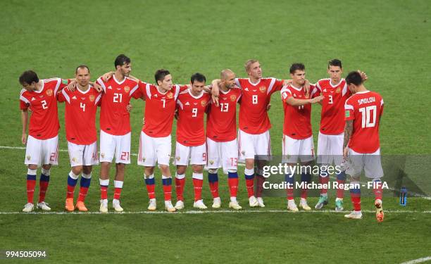 Russia players encourage Fedor Smolov after the missed penalty part of the penalty shoot out during the 2018 FIFA World Cup Russia Quarter Final...