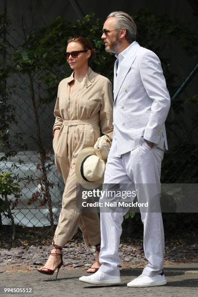 Stella McCartney and Alasdhair Willis seen arriving at Wimbledon Day 7 on July 9, 2018 in London, England.