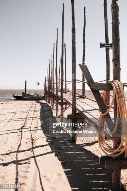 the wooden pier to the ferry boat from texel to vlieland - weide stock pictures, royalty-free photos & images