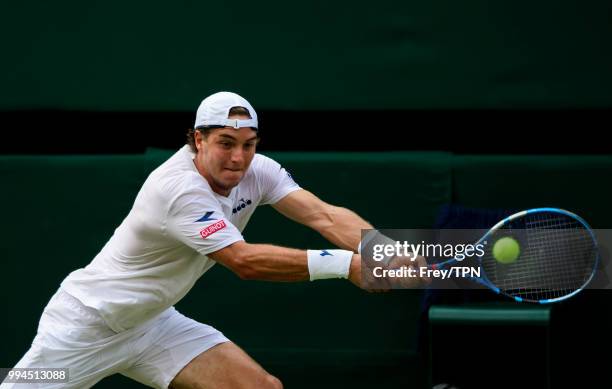 Jan-Lennard Struff of Germany in action against Roger Federer of Switzerland in the third round of the gentlemen's singles at the All England Lawn...