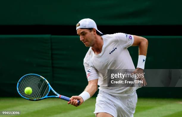 Jan-Lennard Struff of Germany in action against Roger Federer of Switzerland in the third round of the gentlemen's singles at the All England Lawn...