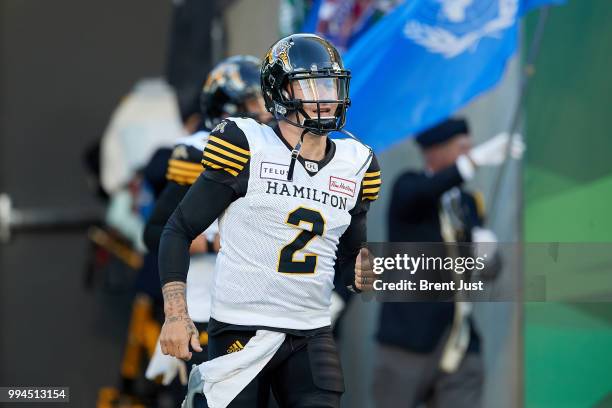 Johnny Manziel of the Hamilton Tiger-Cats takes the field for the game between the Hamilton Tiger-Cats and Saskatchewan Roughriders at Mosaic Stadium...