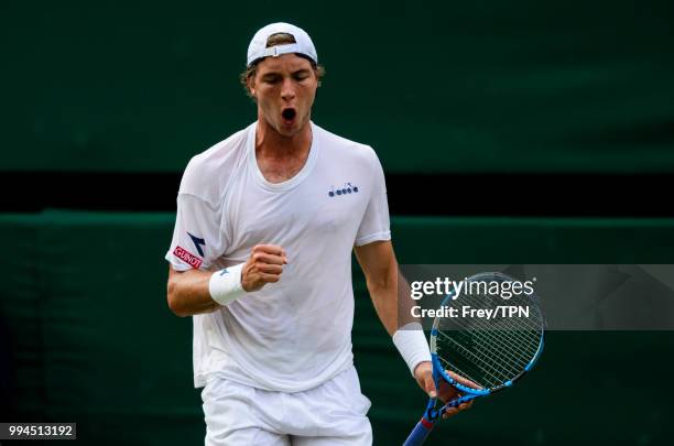 Jan-Lennard Struff of Germany in action against Roger Federer of Switzerland in the third round of the gentlemen's singles at the All England Lawn...