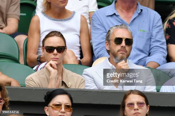 Stella McCartney and her husband Alasdhair Willis attend day seven of the Wimbledon Tennis Championships at the All England Lawn Tennis and Croquet...