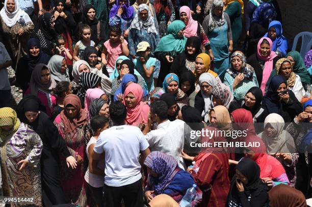 Relatives of killed Tunisian police officer Sgt. Arbi Guizani mourn during his funeral in the capital Tunis' northwestern suburb of Ettadhamen on...