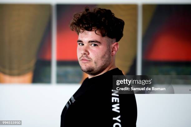 Jordi Acevedo wears Bershka shoes, an H&M dress and a Dominico handbag during the Mercedes Benz Fashion Week Spring/Summer 2019 at IFEMA on July 9,...