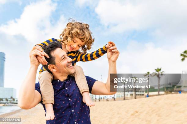 With Dad 440 A Father Giving His Son A Piggyback Stock Photos, High-Res Pictures ...