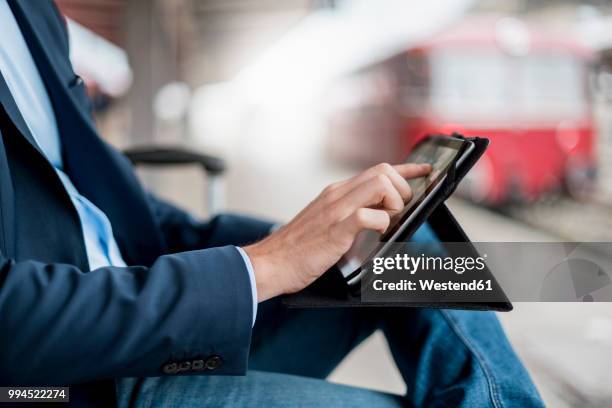 close-up of businessman at the station using tablet - train platform bildbanksfoton och bilder