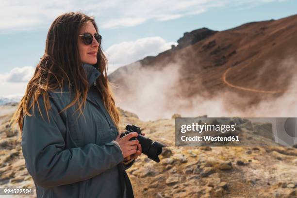 iceland, hverarond field, female photographer - nordurland eystra imagens e fotografias de stock