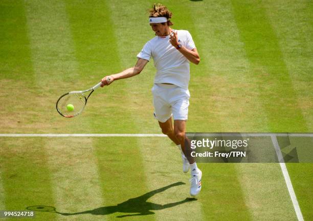 Alexander Zverev of Germany in action against Taylor Fritz of the United States in the third round of the gentlemen's singles at the All England Lawn...