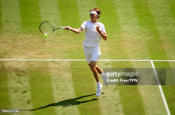 Alexander Zverev of Germany in action against Taylor Fritz of the United States in the third round of the gentlemen's singles at the All England Lawn...