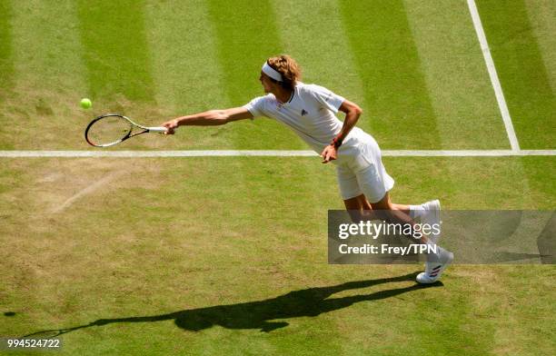 Alexander Zverev of Germany in action against Taylor Fritz of the United States in the third round of the gentlemen's singles at the All England Lawn...