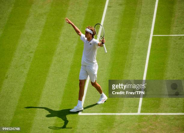 Alexander Zverev of Germany celebrates beating Taylor Fritz of the United States in the third round of the gentlemen's singles at the All England...