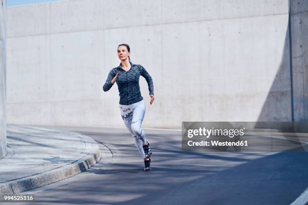 female jogger on street - one katowice 2018 bildbanksfoton och bilder