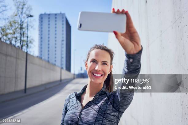 happy woman taking selfie during urban workout - one katowice 2018 bildbanksfoton och bilder