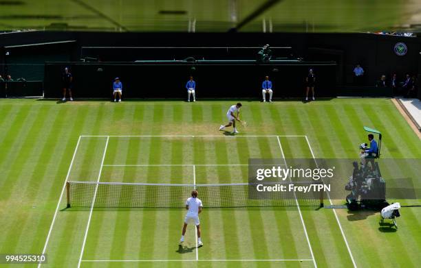 Taylor Fritz of the United States in action against Alexander Zverev of Germany in the third round of the gentlemen's singles at the All England Lawn...